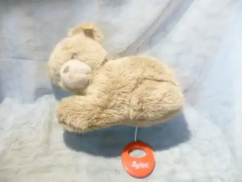 Spieluhr Steiff liegender Bär Masse : 23x22cm. hergestellt 1977 Knopf und Fahne. hergestellt ab 1977
