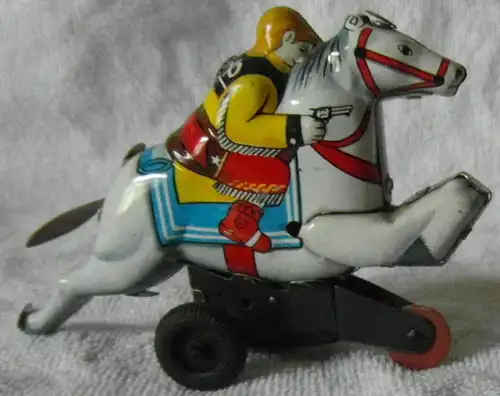 Blechspielzeug, Reiter auf weißem Pferd mit Schwungradantrieb