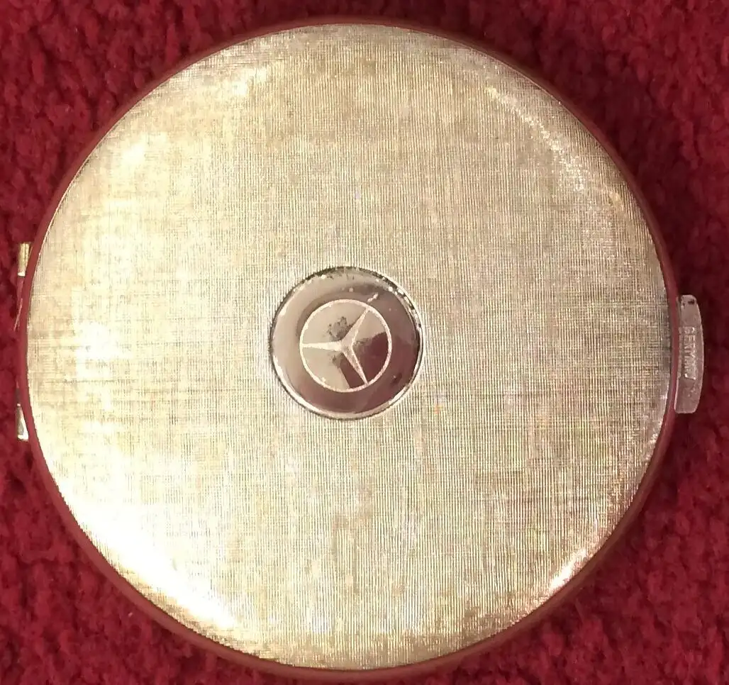 Seltene aufklappbare runde Puderdose aus Metall mit Mercedes-Stern