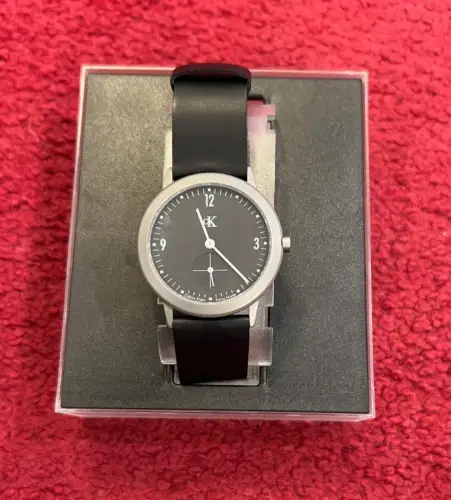 Herrenarmbanduhr, Calvin Klein, Quartz, rund,Titan,flach, Schwarz,Kunststoffband