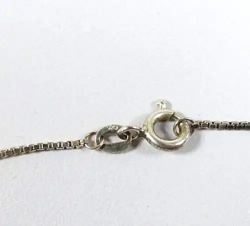 Kette aus 925 Silber und Anhänger aus 800 Silber mit rotem und weißen Steinen