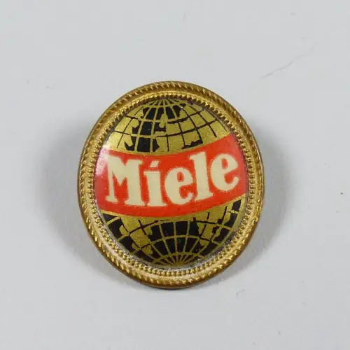 Miele Anstecker/Brosche Weltkugel goldener Rand Zelluloid  (da5216) 