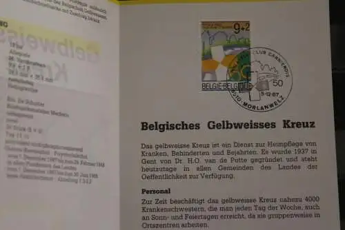 Belgien 1987; Ankündigungsblatt mit Schwarzdruck und Marke und ESST: Gelbweisses Kreuz; Deutsche  Ausg.