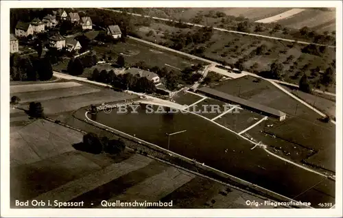 [Echtfotokarte schwarz/weiß] Bad Orb i. Spessart - Quellschimmbad, Orig.-Fliegeraufnahme, 16393. 