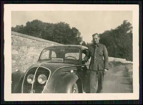 Photo Wehrmacht PKW Fahrzeug soldier with loot Beute Peugeot 202 France 1941