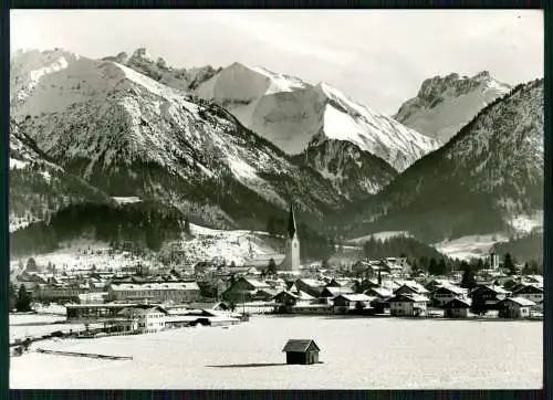 Foto AK - Oberstdorf im Allgäu mit Kratzer - Winter verschneites Dorf mit Kirche