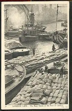 England. London Life: The Busy docks in the Port of London.