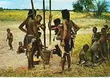 x04711; River Bushmenn. Mabakakwe women stemping grain.