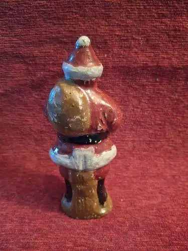 Alte Massefigur Weihnachtsmann mit Sack auf dem Rücken 13cm hoch