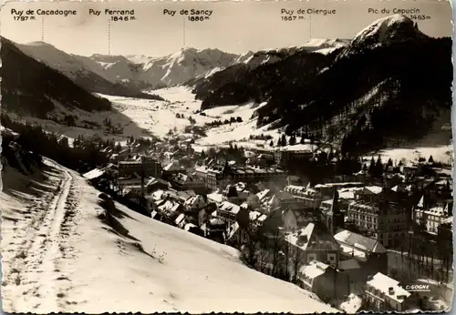 13356 - Frankreich - Le Mont Dore , Station Thermale et touristique , Vue generale en hiver , Puy de Cacadogne , Puy Ferrand , Puy de Sancy ,Puy de Cliergue , Puy de Capucin - gelaufen 1956