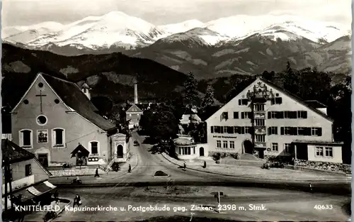 14793 - Steiermark - Knittelfeld , Kapuzinerkirche und Postgebäude gegen Zinken , leicht beschädigt - gelaufen 1988