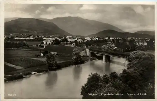 Villach, Eisenbahnbrücke, Drau und lind -345588
