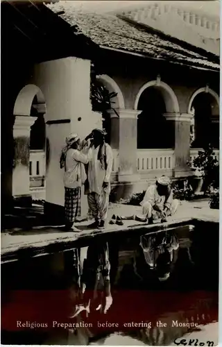 Religious Preperation before entereing the Mosque -23826