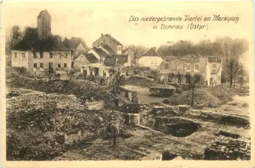 Ostpreussen - Niedergebranntes Viertel am Marktplatz in Domnau -685292