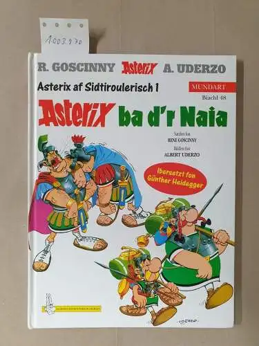 Goscinny, René und Albert Uderzo: Goscinny, René: Asterix Mundart; Teil: Biachl 48., Asterix af sidtiroulerisch. - 1. Asterix ba d'r Naia. 
 Satzlen fon Rene Goscinny. Bildlen fon Albert Uderzo. Ibersetzt fon Günther Heidegger. 