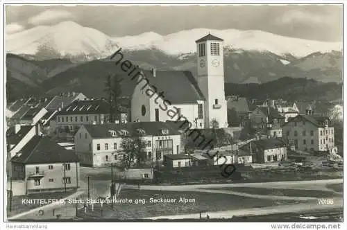 Knittelfeld - Stadtpfarrkirche gegen Seckauer Alpen - Foto-AK