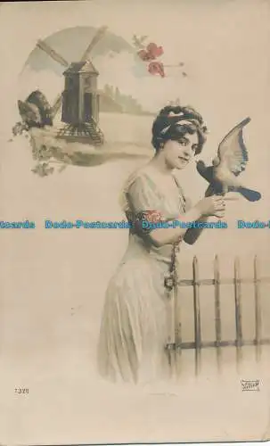 R048772 alte Postkarte. Frau mit Vogel. 1915