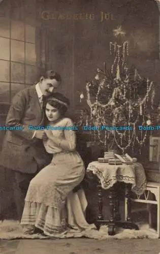 R147057 Glaedelig Jul. Frau und Mann. 1918