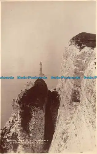 R162287 Klippen und Leuchtturm. Strandkopf. Donlion. RP