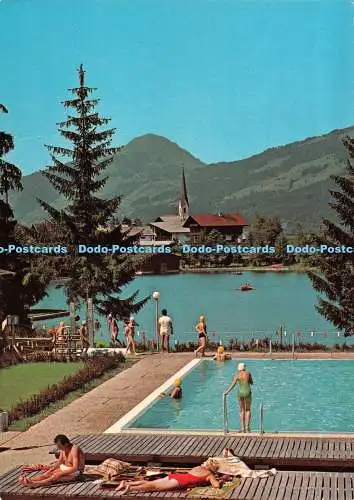 D086621 Kirchberg. Tirol. Gegen Hohe Salbe. Badesee und geheiztes Schwimmbad. Re