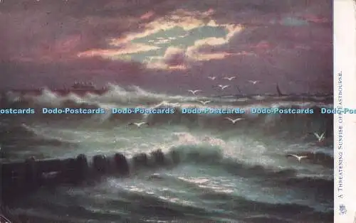 R714727 Ein bedrohlicher Sonnenaufgang vor Eastbourne. Raue See an der Südküste. Tuc