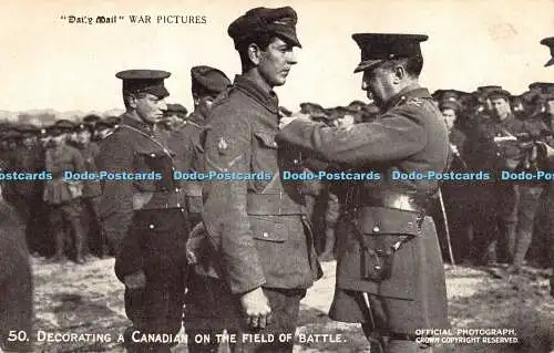 R471809 Daily Mail War Pictures 50 Decorating a Canadian on the Field of Battle
