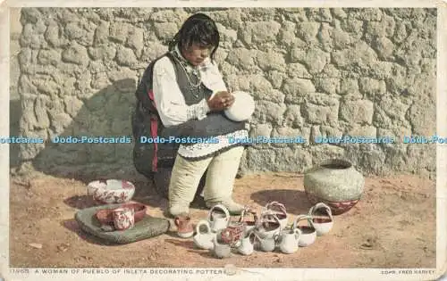 R617125 11968 A Woman of Pueblo of Isleta decorating Pottery Copr Fred Harvey Ph