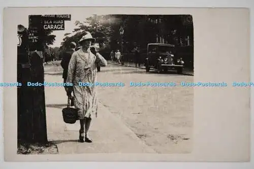 C026182 Woman Stands On The Street Motor Tours Sea Road Garage Sunfilms