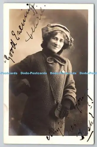 R766572 Woman in a Coat and Hat U S A Studios