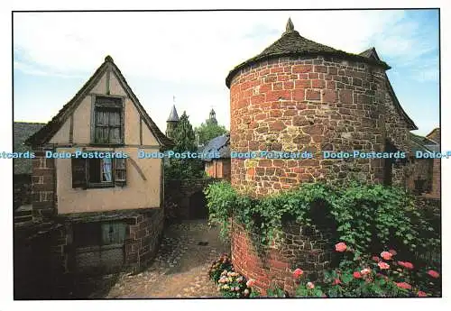 D142889 Collonges La Rouge Correze Dans la rue Noire tour fleurie et maison a co