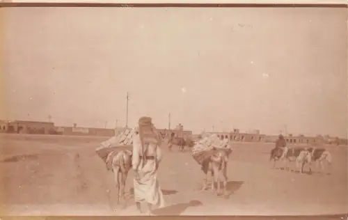 B078 Irak Ureinwohner mit Turbanen Eseln pflegen Betonblöcke RPPC Postkarte