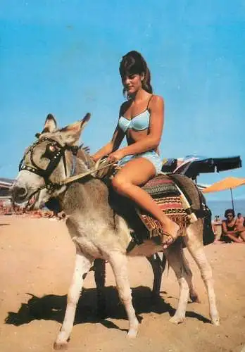 Bulgaria Black Sea littoral beautiful woman riding donkey