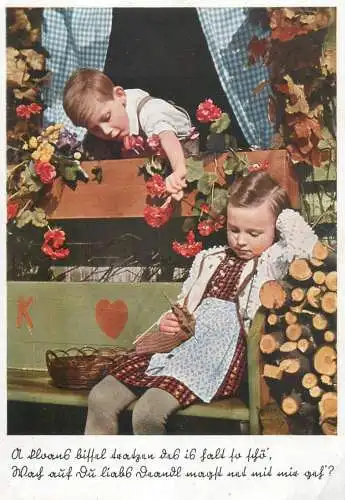 Blond young children wearing folk traditional costumes