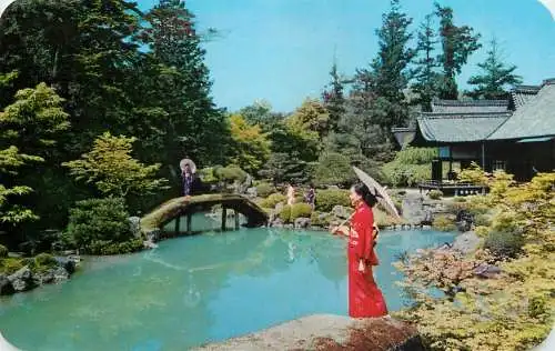 Japan ethnic woman in a japanese garden typical clothing