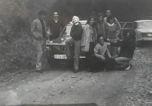 Anonymous persons souvenir photo Romania Dacia car Sibiu