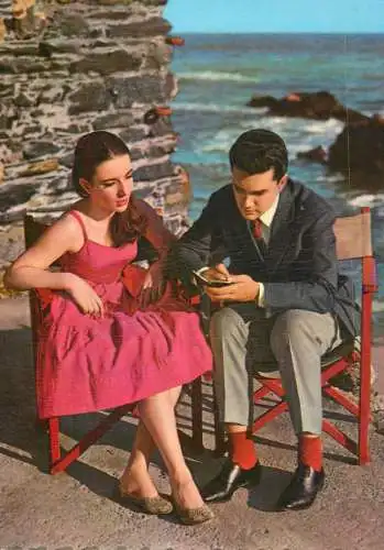 Elegant lovers couple in picturesque seaside scenery