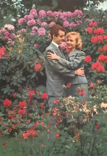 Elegant couple romantic hug in the garden