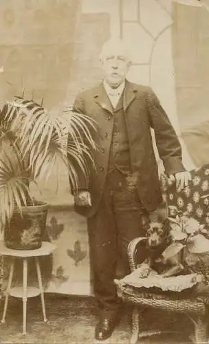 Social history annonymous persons souvenir photo elegant man and dog