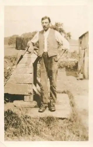Social history annonymous persons souvenir photo man in the yard 1928