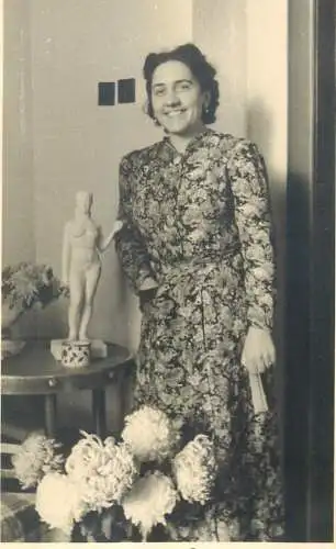 Photograph woman smile flower statue