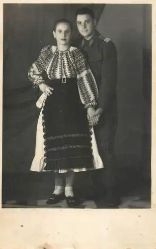 Photograph woman in traditional costume and soldier officer