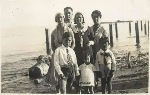 Real photo elegant family at the beach