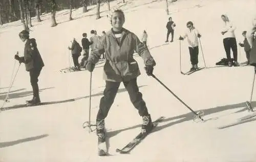 Real photo child skiing on slope