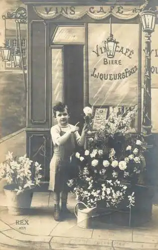 Real photo boy selling flowers France cafe