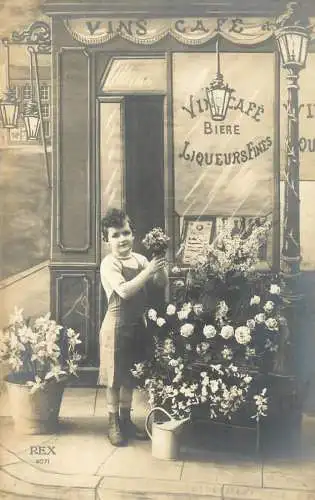Real photo boy selling flowers France cafe