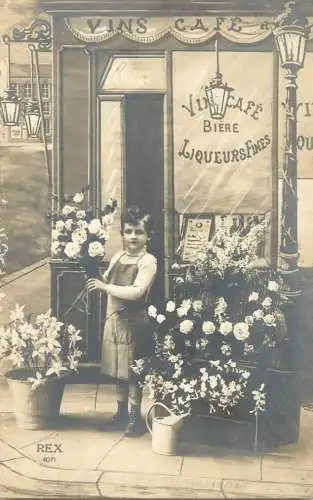 Real photo boy selling flowers