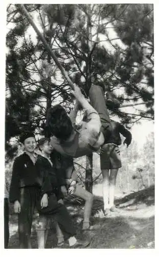 Social history anonymous persons portrait souvenir children play in forest