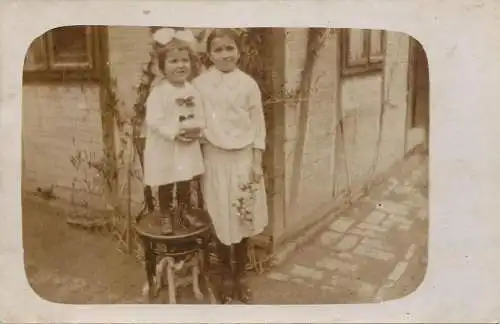 Social history anonymous persons portrait souvenir girls in the yard