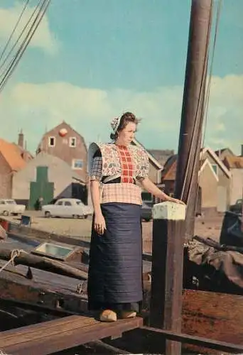 Netherlands Spakenburg (Utrecht) woman in typical clothing near fishing boat