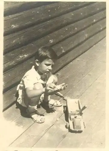 Anonymous persons photo boy wooden toy